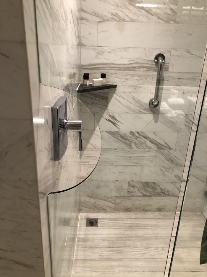 hotel bathroom lets you turn on the shower without having to enter, design win