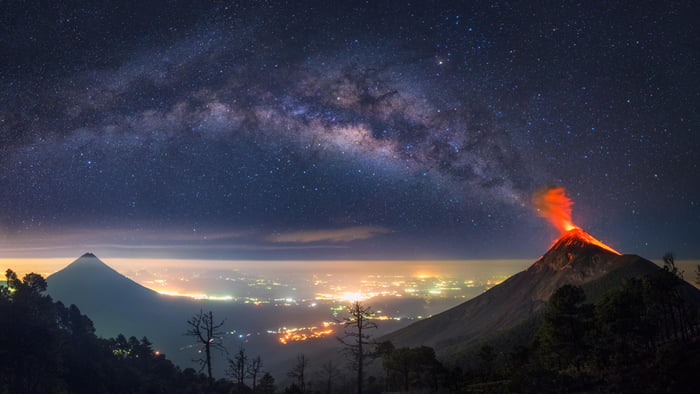 this volcano in guatemala looks like it's erupting the milky way