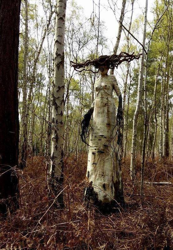 freaky dead tree carving of witch from birch