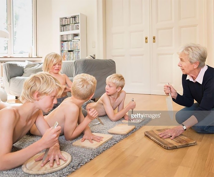 blonde kid knife game with grandma, weird stock images