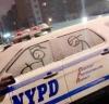 cop and criminal on snowy police car windows