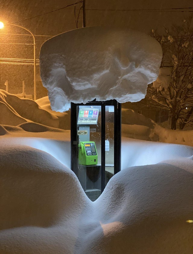 snowfall in japan on telephone booth, nature is amazing