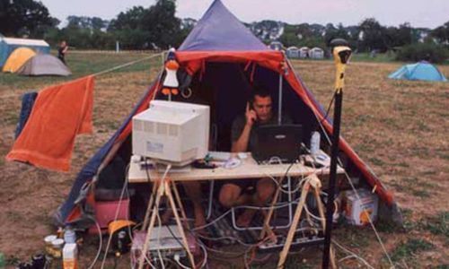 who wants to go camping?, computers outside a tent