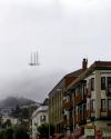 the illusion of the flying dutchman’s ship, just the tip of a sutro tower peeking out of the notorious fog in san francisco