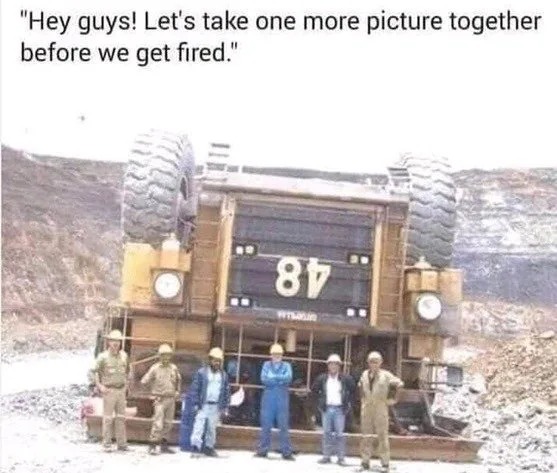 hey guys, let's take one more picture before we get fired, mining truck upside down