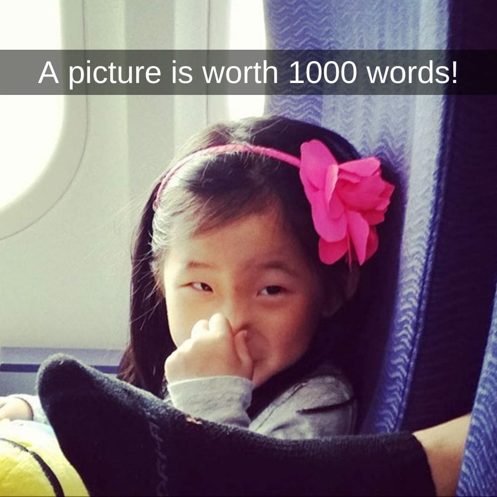 a picture is worth 1000 words, little girl plugging nose in front of dirty feet with socks on airplane