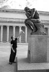 robin williams offering a toilet roll to the thinker, san francisco. 1990.