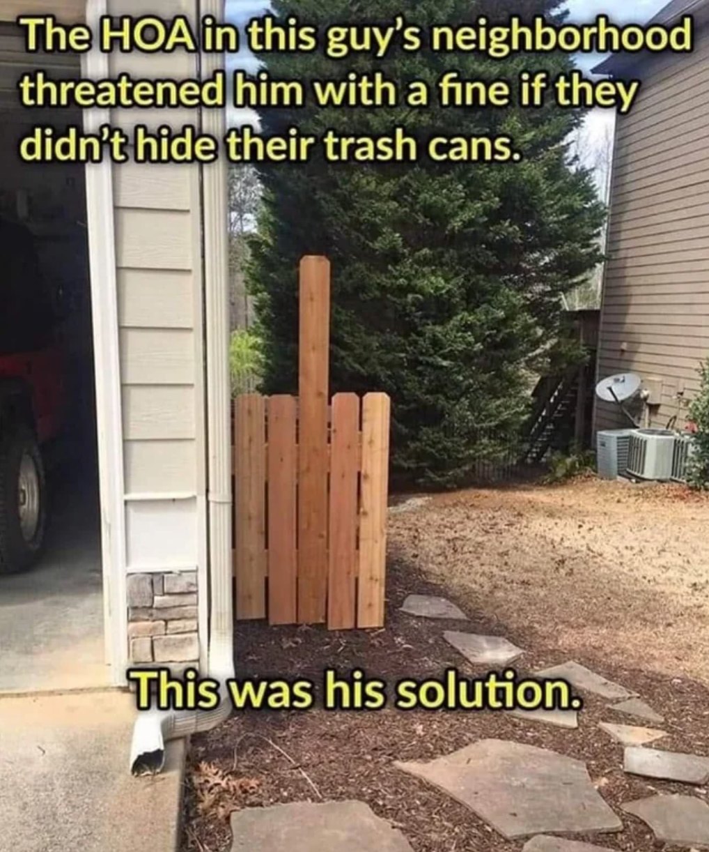the hoa in this guy's neighborhood threatened him with a fine if they didn't hide their trash cans, this was his solution, middle finger fence