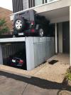 seemed like a good idea to have a car elevator, jeep crushed by car elevator