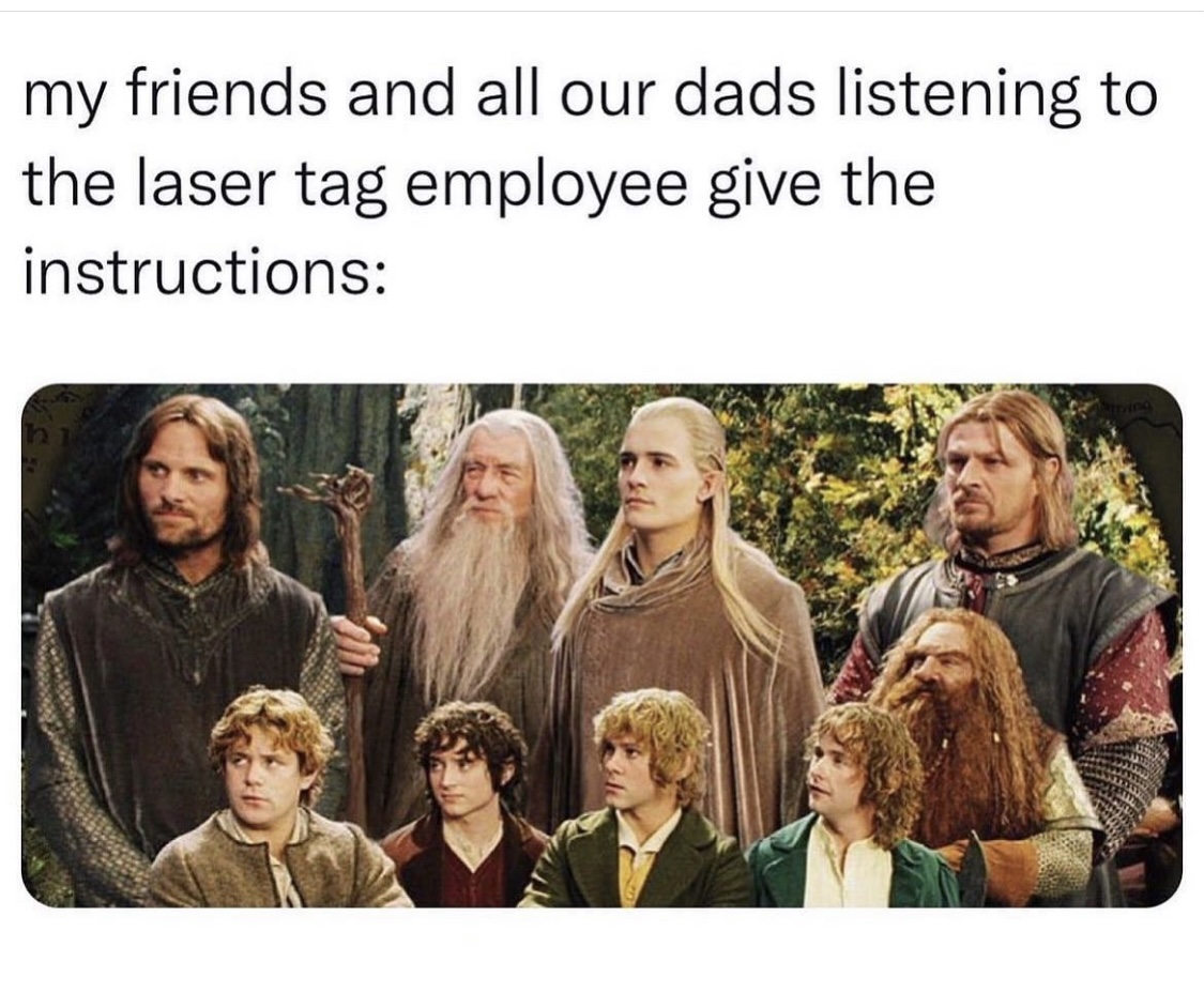 my friends and all our dads listening to the laser tag employee give the instructions