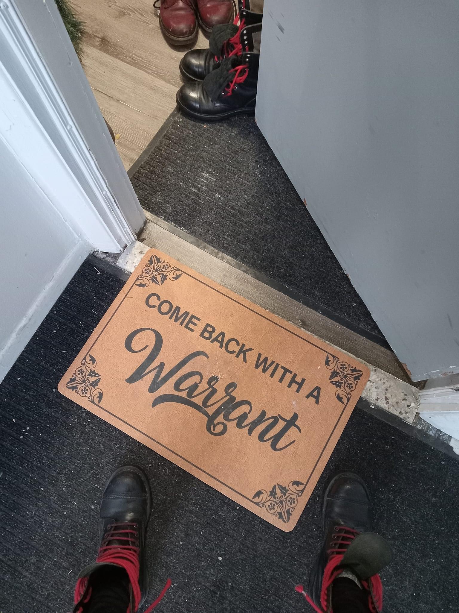 come back with a warrant, welcome mat