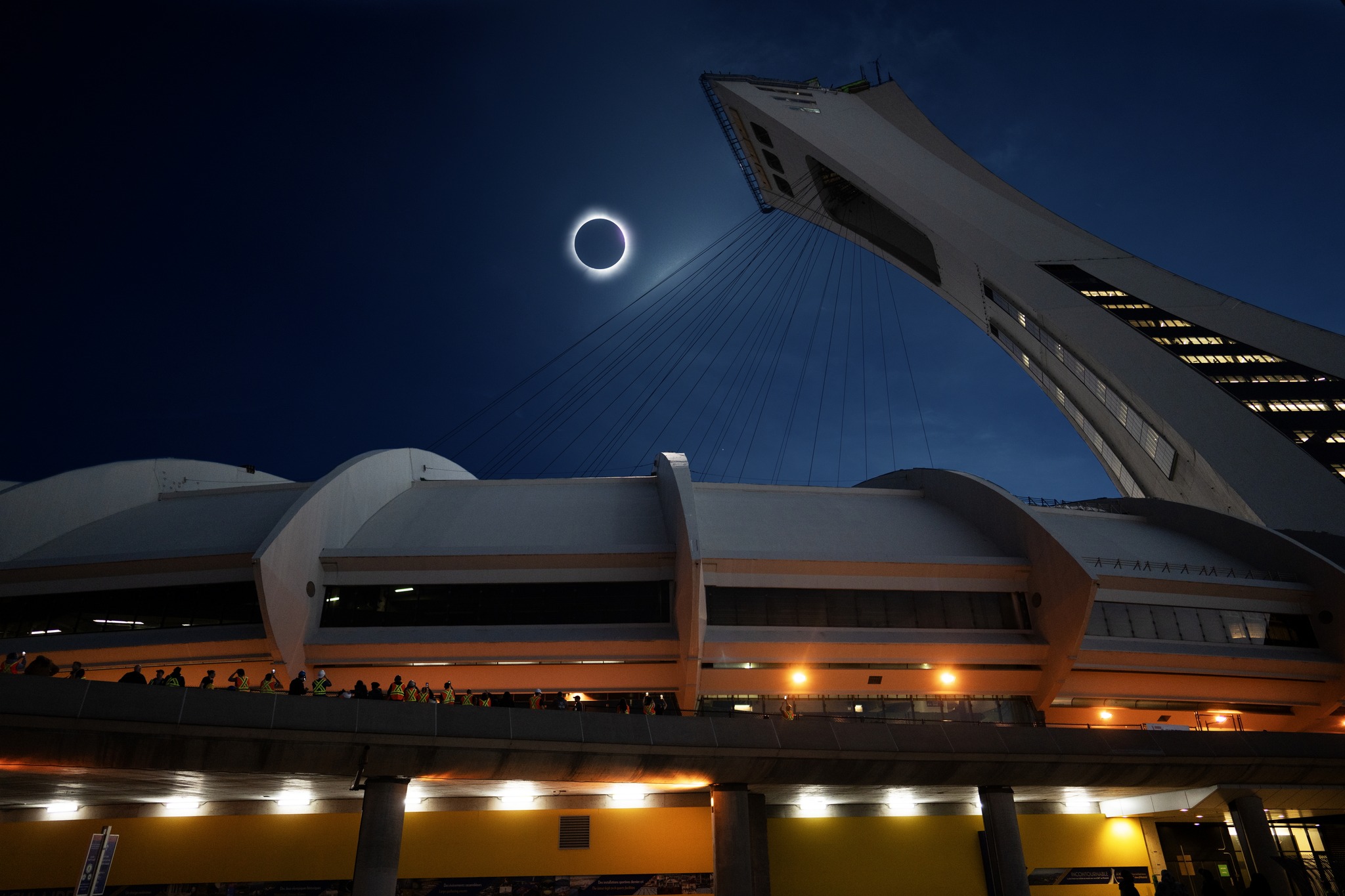 solar eclipse over the olympic stadium in montreal canada